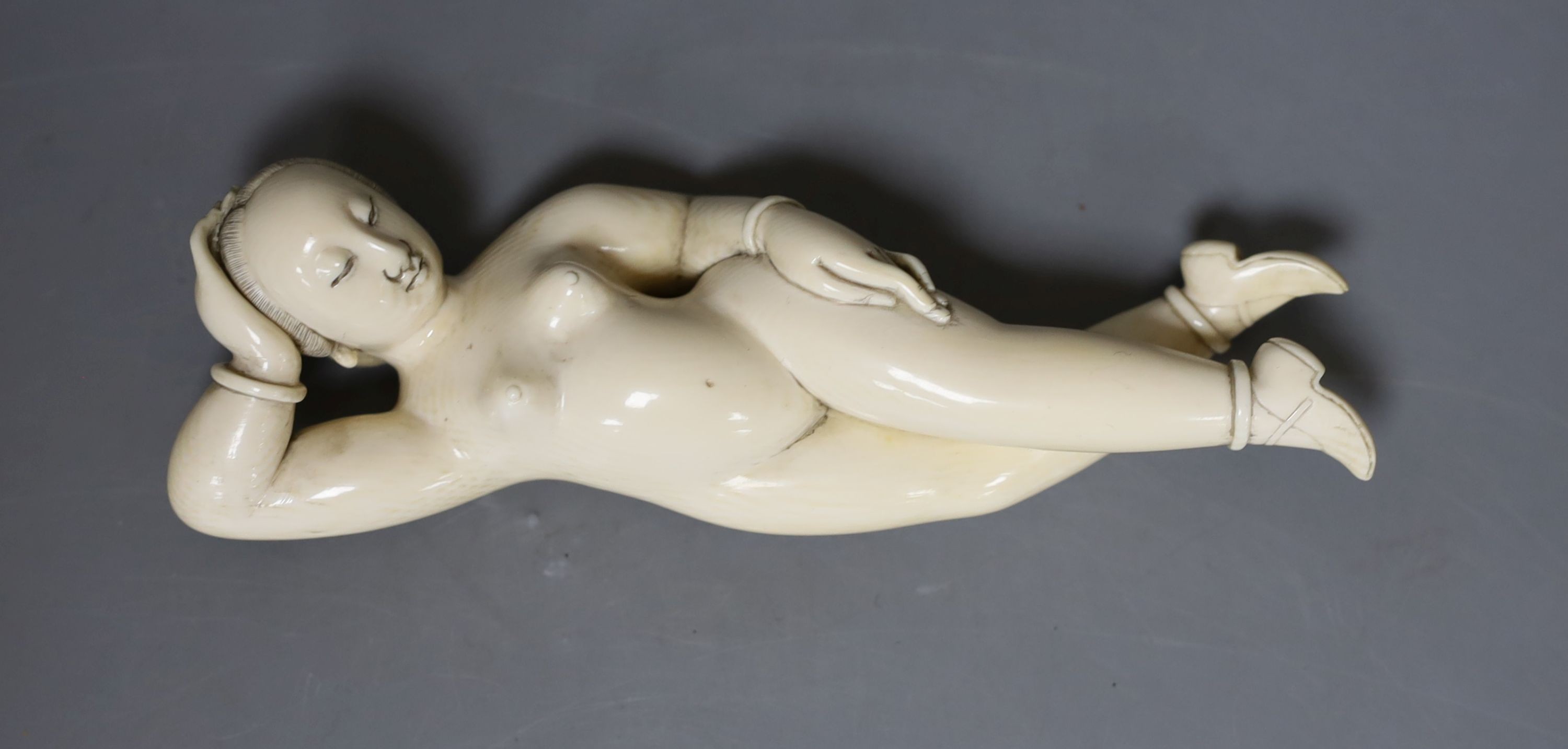 A 19th century Chinese carved ivory medicine doll, 15cm
